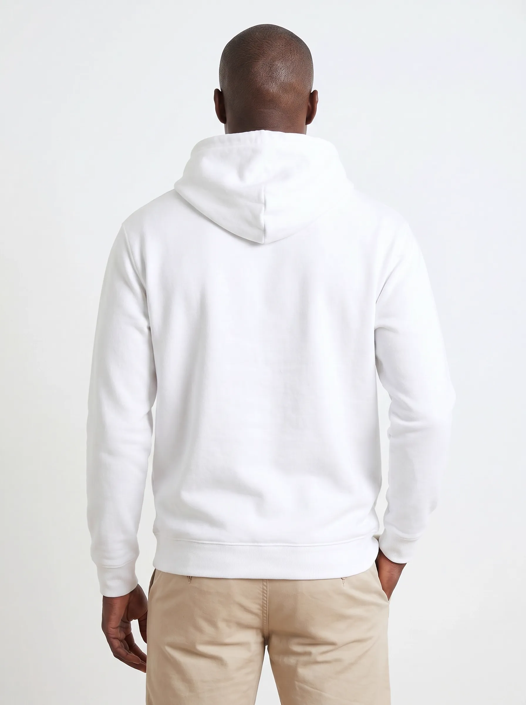 MODA AI output 4 — Black male model in white Bödie Surf Co hoodie, chest logo legible, demonstrating logo reproduction and skin tone realism