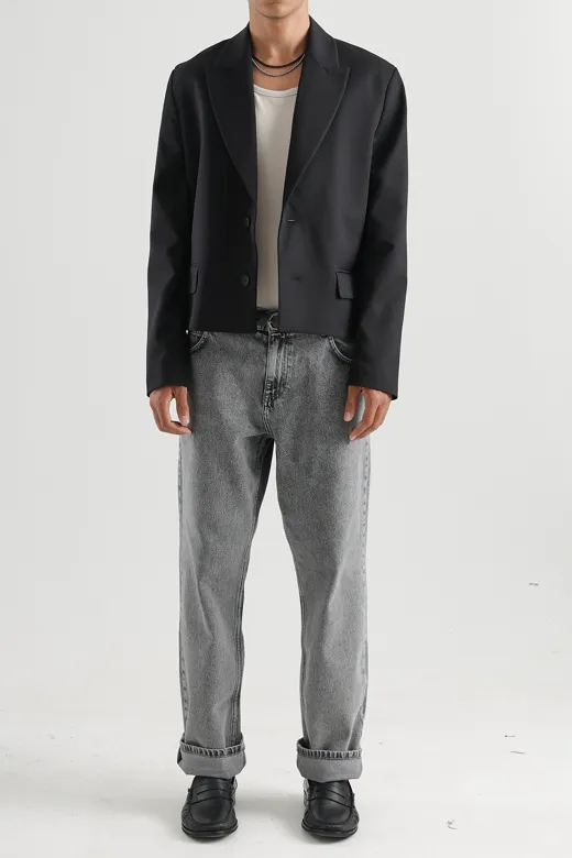 The starting photo for Relaxed Blazer in Black: an existing model photo of the blazer and jeans