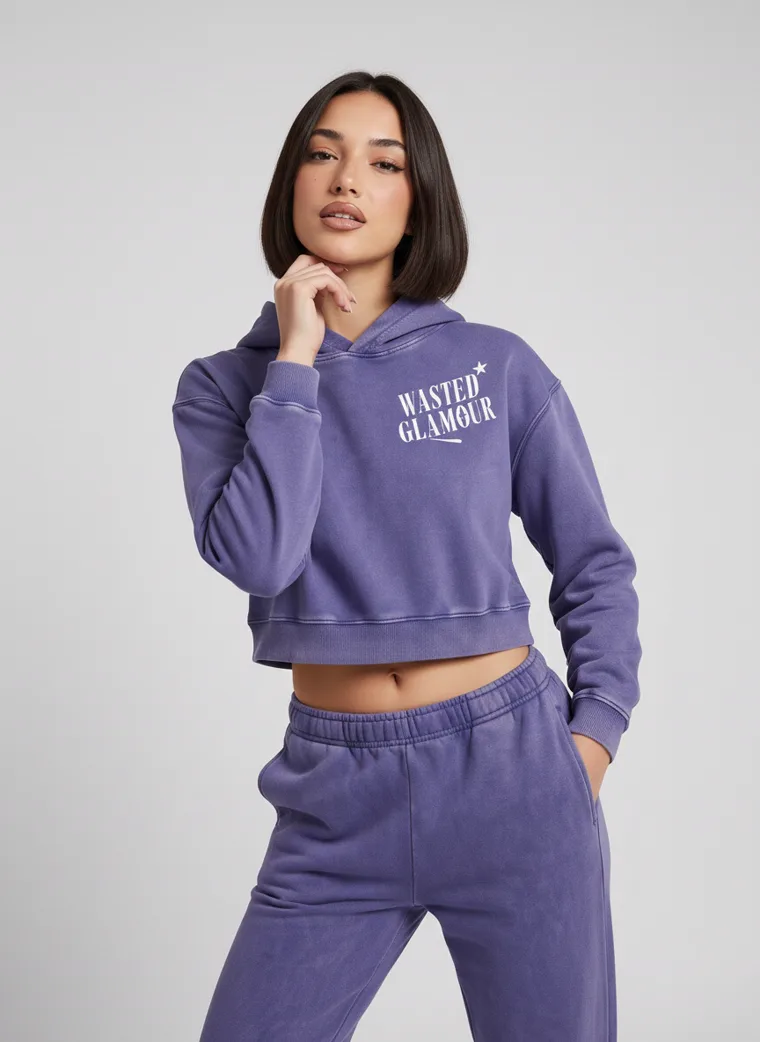 A washed violet cropped hoodie with a butterfly back print and matching sweatpants on pale grey. Cropped Hoodie Set in Violet, frame 1 of 5
