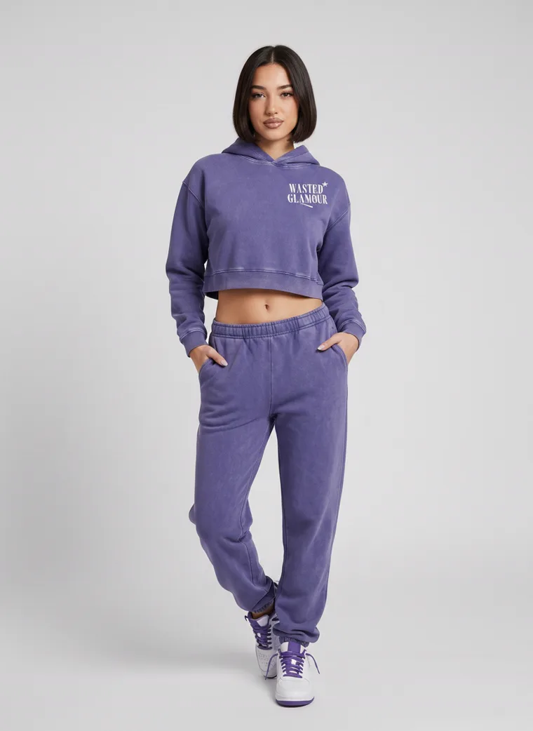 A washed violet cropped hoodie with a butterfly back print and matching sweatpants on pale grey. Cropped Hoodie Set in Violet, frame 5 of 5