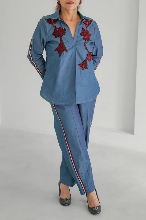 Input photo — a blue embroidered co-ord photographed on a person with the head cropped out of frame