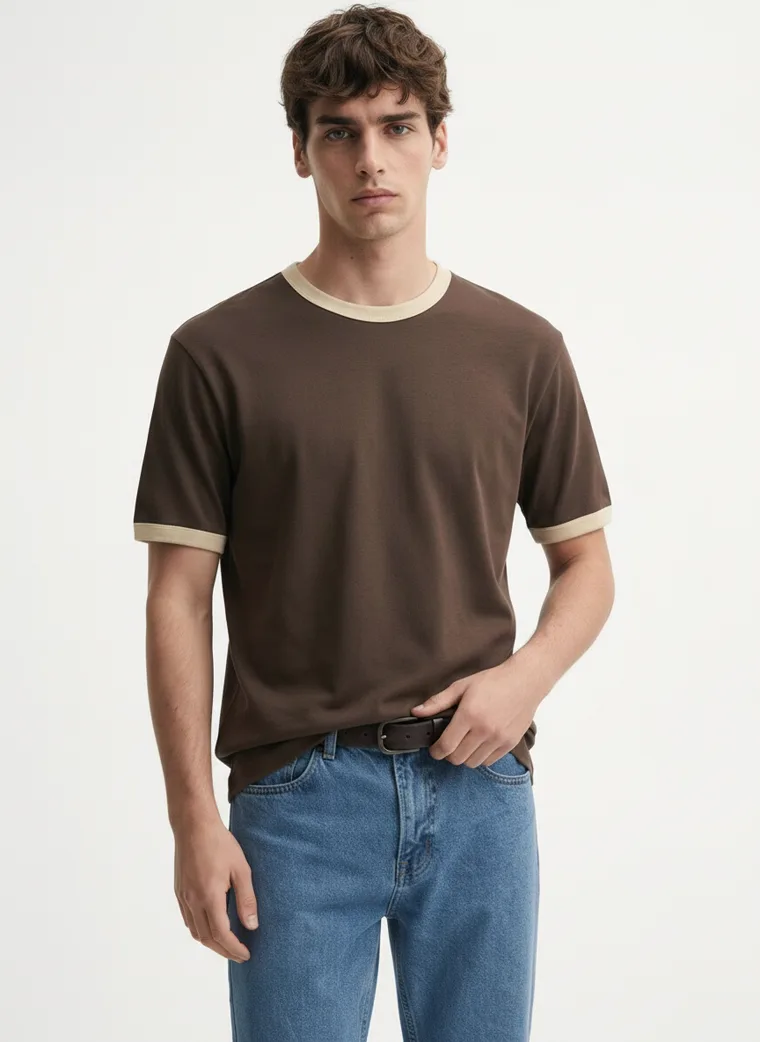 MODA AI output — the brown ringer tee and jeans on a full-length male model in a clean studio