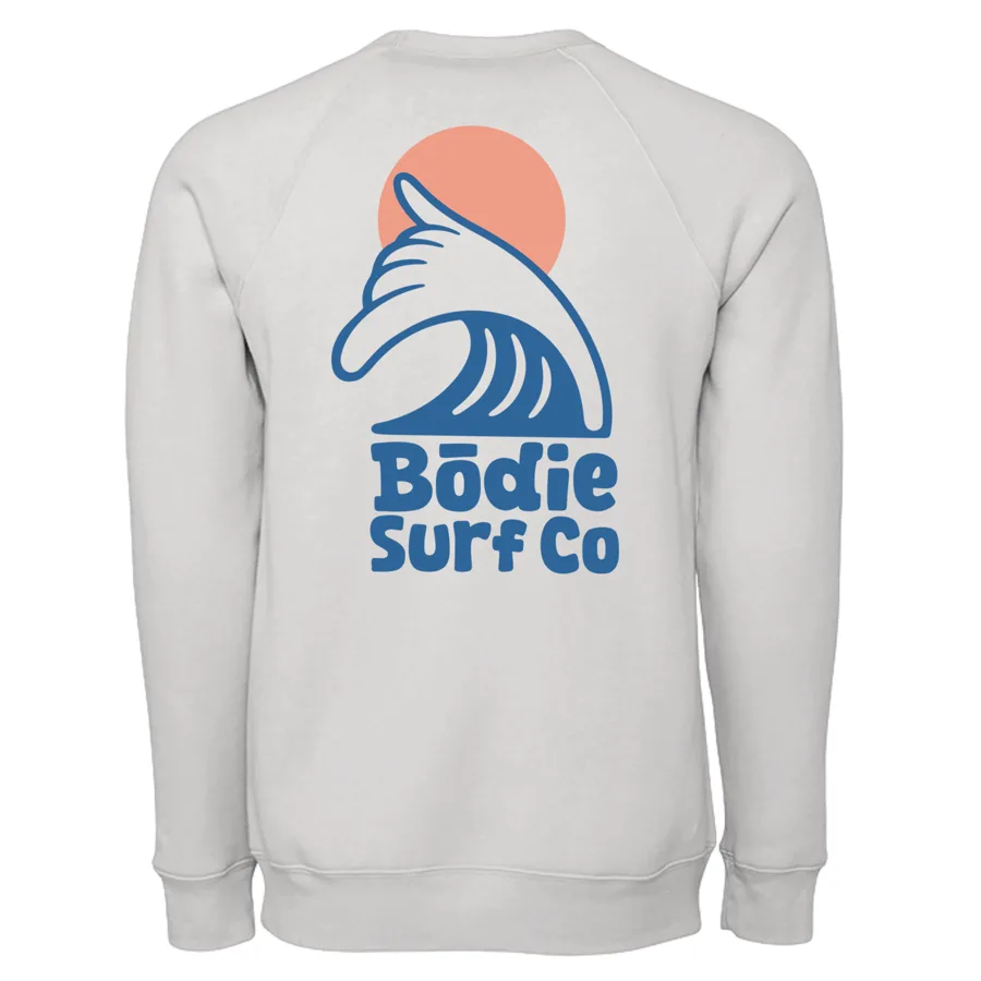 Input mockup — heather-grey crewneck back with the large Bodie Surf Co wave and sun logo overlaid, reading Bodie Surf Co