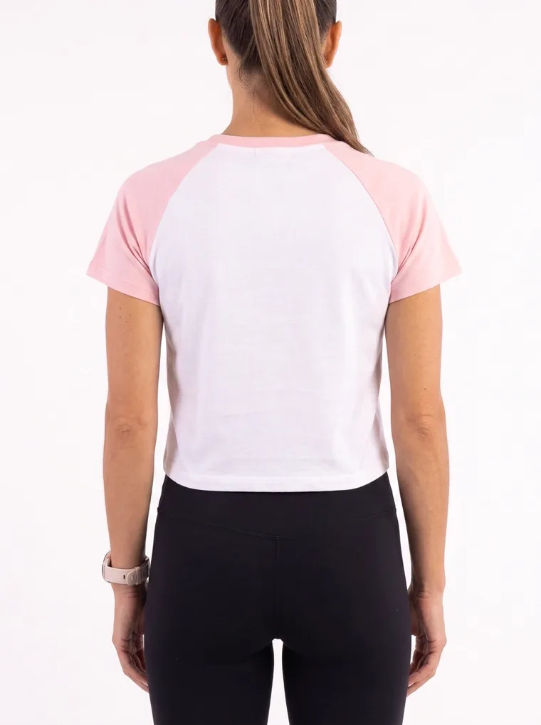MODA AI output — the raglan tee in blush pink, back view, blank back with raglan seams visible