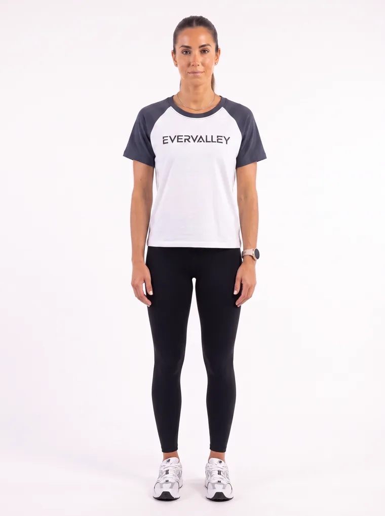 MODA AI output — the raglan tee in navy on a model, straight-on front, full length, clean studio