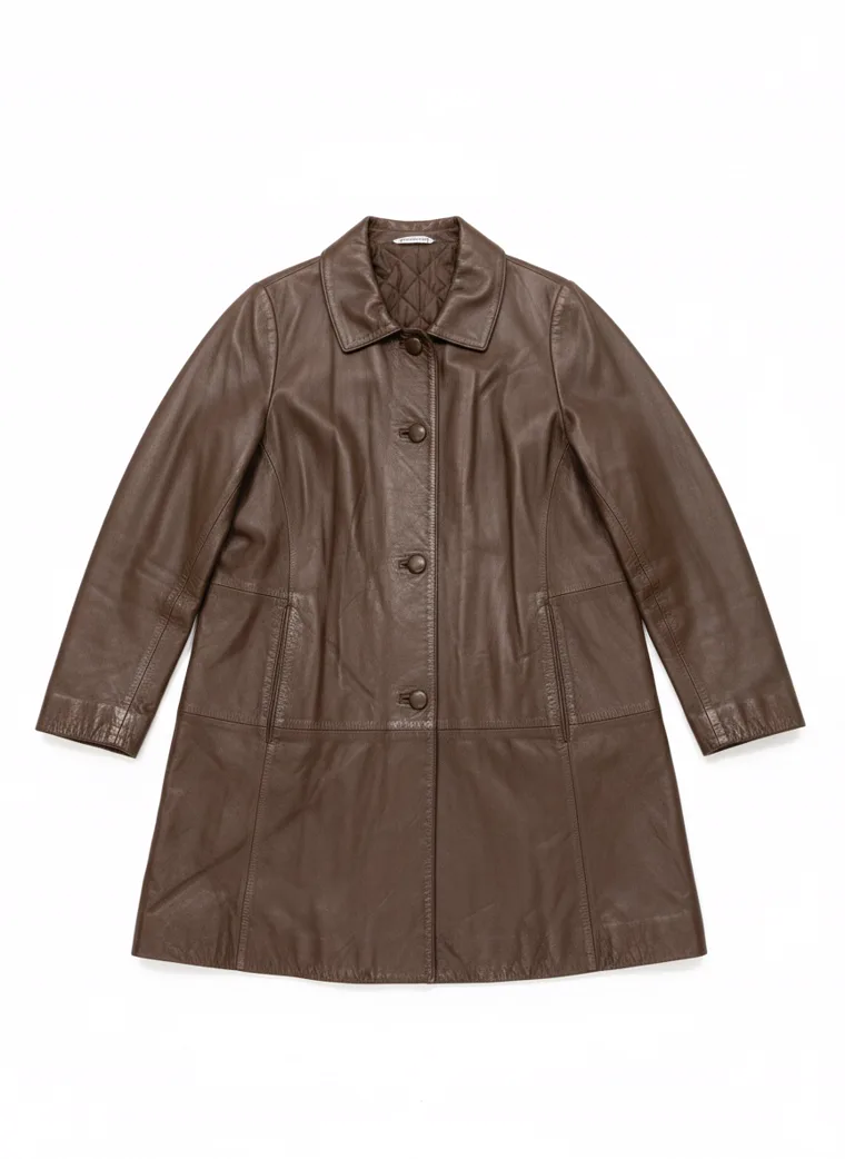 A brown leather car coat with a point collar, button front and quilted lining, worn with a black roll neck and black trousers. Leather Car Coat in brown, laid flat