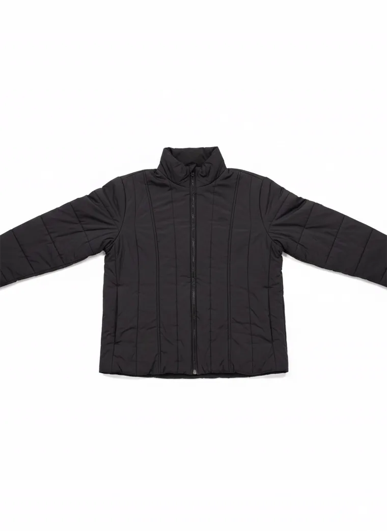 A dark brown channel-quilted puffer jacket with a stand collar and zip front, worn with grey trousers. Channel-Quilted Puffer in dark brown, laid flat