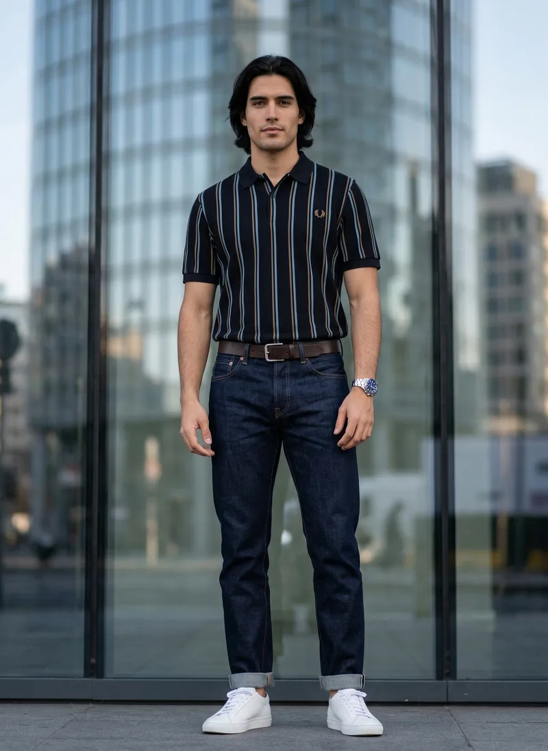 MODA AI output, the front view. The striped navy polo on a generated male model with long dark hair, full length on a city street with glass towers behind