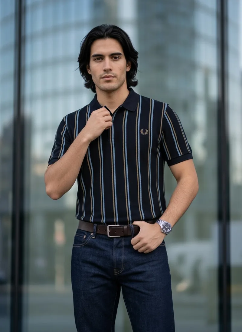 MODA AI catalog shot 2 of 10, three quarter. The striped navy polo, the same generated male model throughout, in a city setting