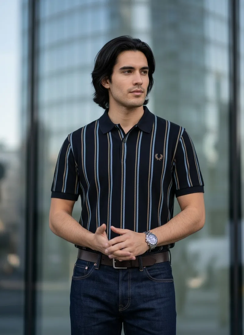 MODA AI catalog shot 7 of 10, front, top focus. The striped navy polo, the same generated male model throughout, in a city setting
