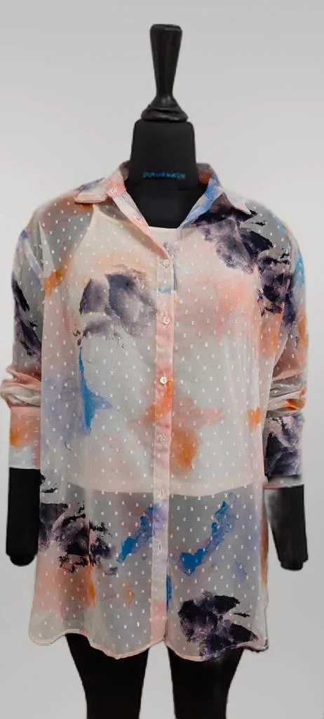OnModel output on a ghost-mannequin shot — the sheer floral top still on a headless black dress form, no model generated