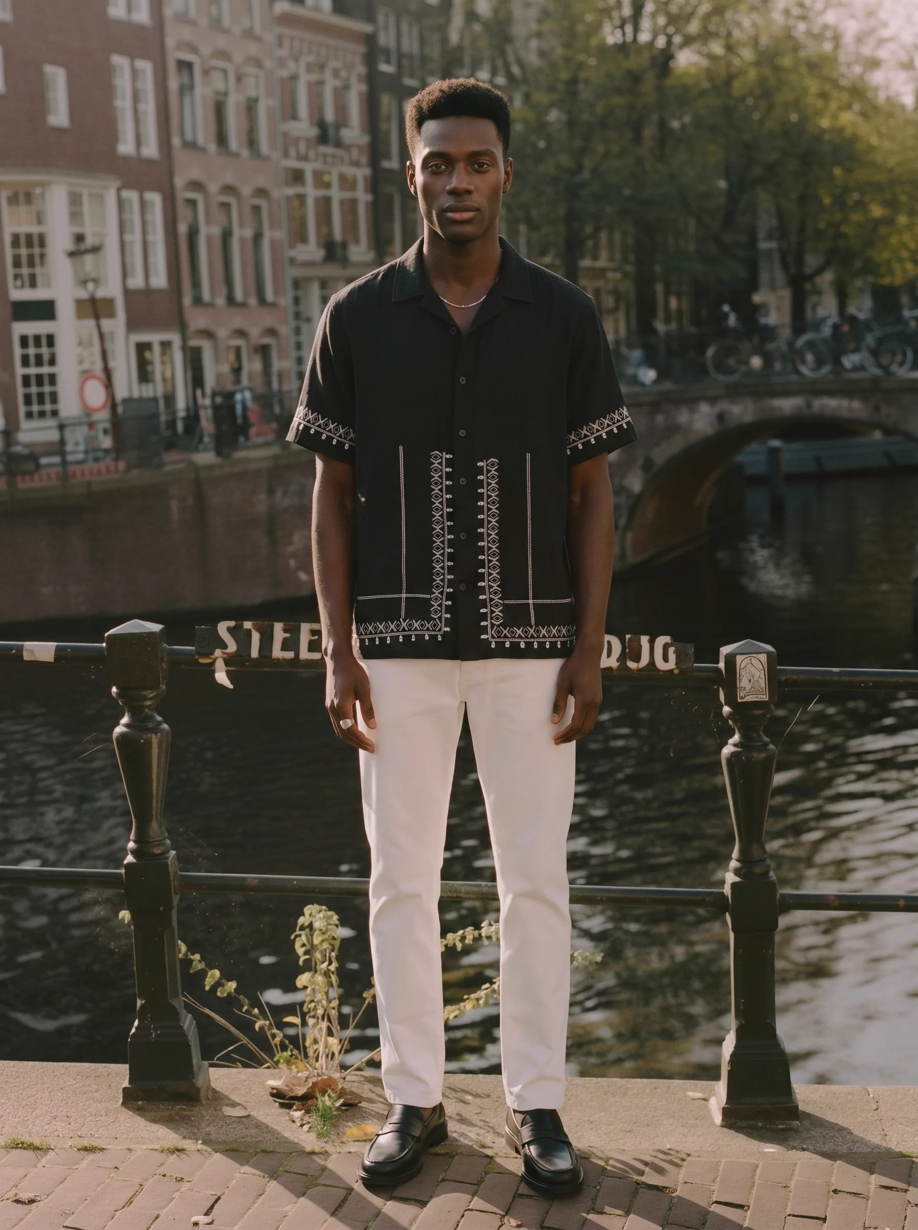 MODA AI catalog output from the PhotoRoom head-to-head — brand model on an Amsterdam canal background reference