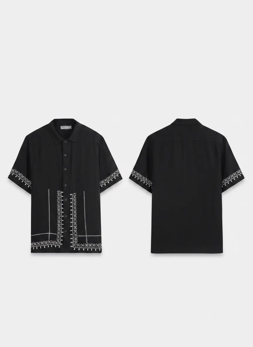 MODA AI output shot 9 of 10 from the same one-credit generation on the black embroidered shirt — brand model matching uploaded face reference, Amsterdam canal scene matching uploaded background reference